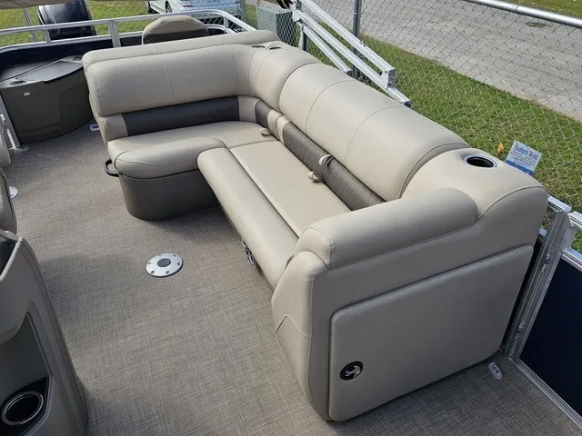 Slide: The Image of A sleek beige sofa on a 2025 Sun Tracker Fishin' Barge 20 DLX pontoon boat. - 15