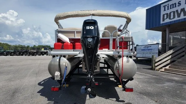 Slide: The Image of A 2025 Sun Tracker Bass Buggy 16 XL Select on a trailer. The outboard motor is visible. - 3