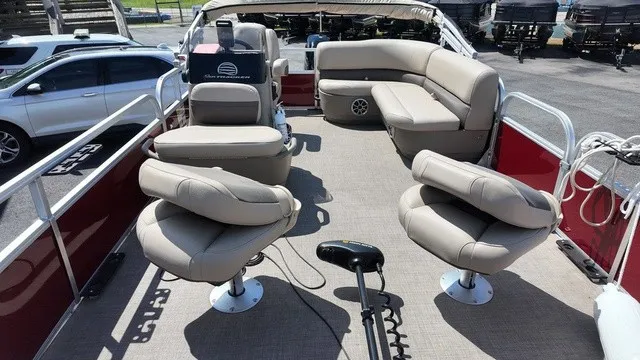 Slide: The Image of The image shows the deck of a 2025 Sun Tracker Bass Buggy 16 XL Select with beige seating. - 10