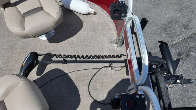Slide: The Image of The image shows the deck of a 2025 Sun Tracker Bass Buggy 16 XL Select with seats and a motor. - 25
