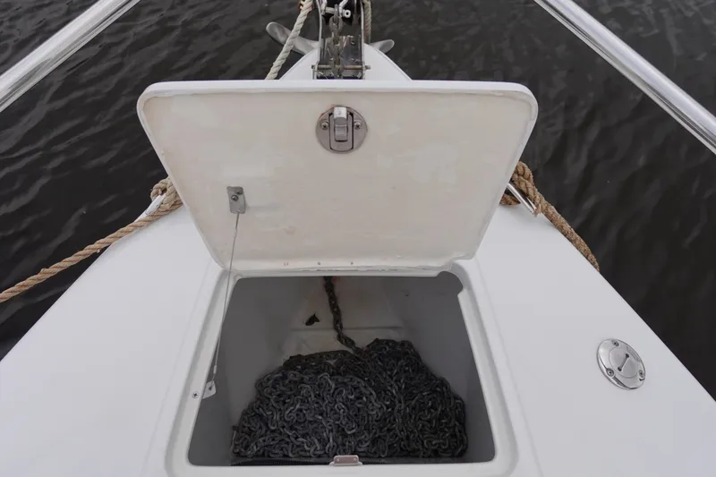 Slide: The Image of Open anchor locker on Formula 280 Sun Sport boat with chain inside. - 17