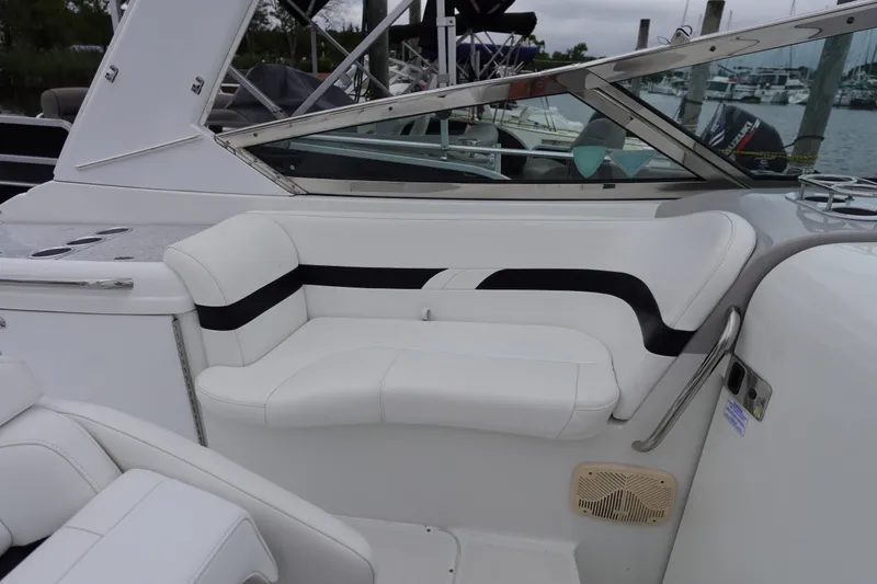 Slide: The Image of Luxury seating on a Formula 280 Sun Sport boat, featuring sleek white and black upholstery. - 25