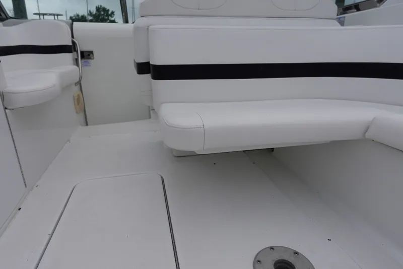 Slide: The Image of Interior seating of Formula 280 Sun Sport boat, featuring white upholstery with black accents. - 32