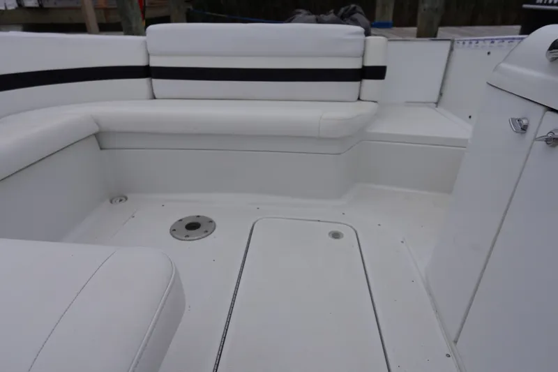 Slide: The Image of Interior seating of a Formula 280 Sun Sport boat, featuring white upholstery. - 31