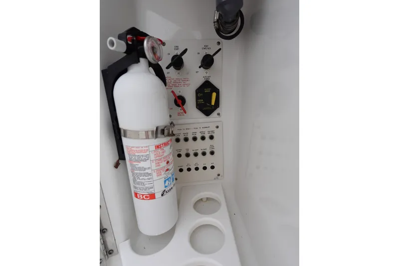 Slide: The Image of Control panel and fire extinguisher on Formula 280 Sun Sport boat. - 38
