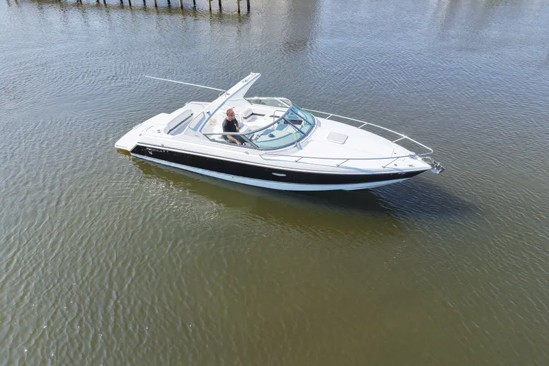 Slide: The Image of Formula 280 Sun Sport boat cruising on calm water, featuring sleek design and spacious deck. - 9