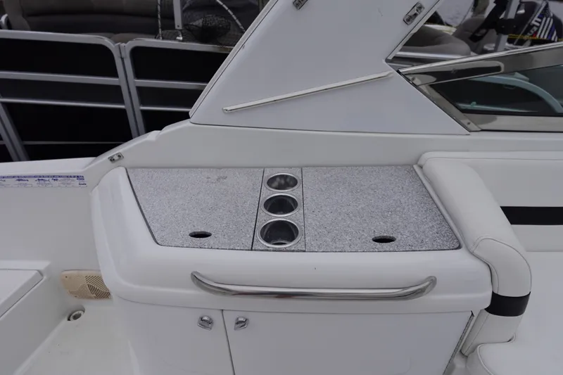 Slide: The Image of Interior view of a Formula 280 Sun Sport boat with cup holders and seating. - 34