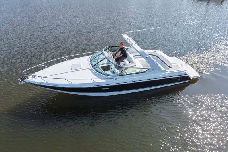 Slide: The Image of A Formula 280 Sun Sport boat cruising on calm water. - 5