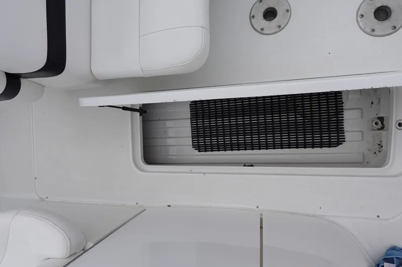 Slide: The Image of 2005 Formula 280 Sun Sport boat interior with open storage compartment and seating. - 33