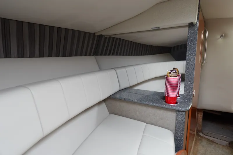 Slide: The Image of Interior of 2005 Formula 280 Sun Sport boat with white seating and countertop. - 56