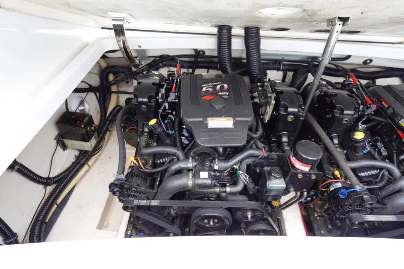 Slide: The Image of Engine compartment of a 2005 Formula 280 Sun Sport boat, showcasing dual MerCruiser engines. - 63