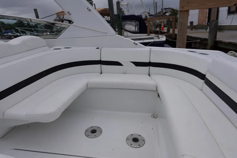 Slide: The Image of Luxury seating area on a Formula 280 Sun Sport boat docked at a marina. - 29
