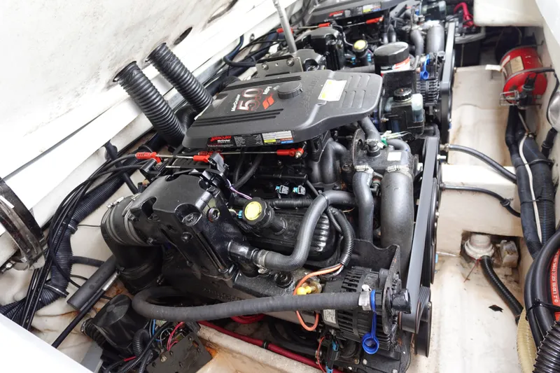 Slide: The Image of Engine compartment of a 2005 Formula 280 Sun Sport boat, showcasing dual Mercury engines. - 65