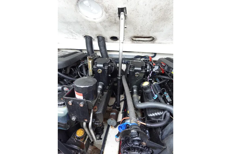 Slide: The Image of Engine compartment of a 2005 Formula 280 Sun Sport boat, showcasing mechanical components. - 70