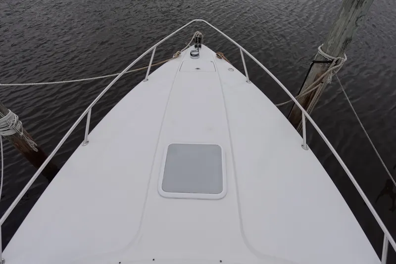 Slide: The Image of Bow view of a Formula 280 Sun Sport boat docked on calm water. - 15