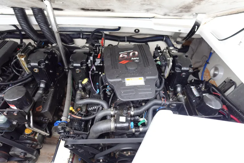 Slide: The Image of Engine compartment of a 2005 Formula 280 Sun Sport boat, featuring a MerCruiser 5.0 MPI engine. - 64