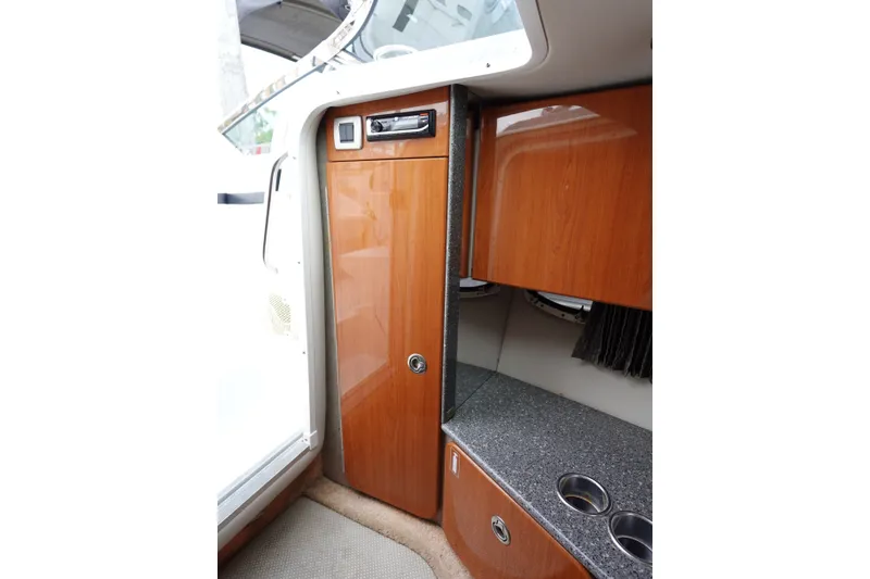 Slide: The Image of Interior of Formula 280 Sun Sport boat with wood cabinetry and countertop. - 46