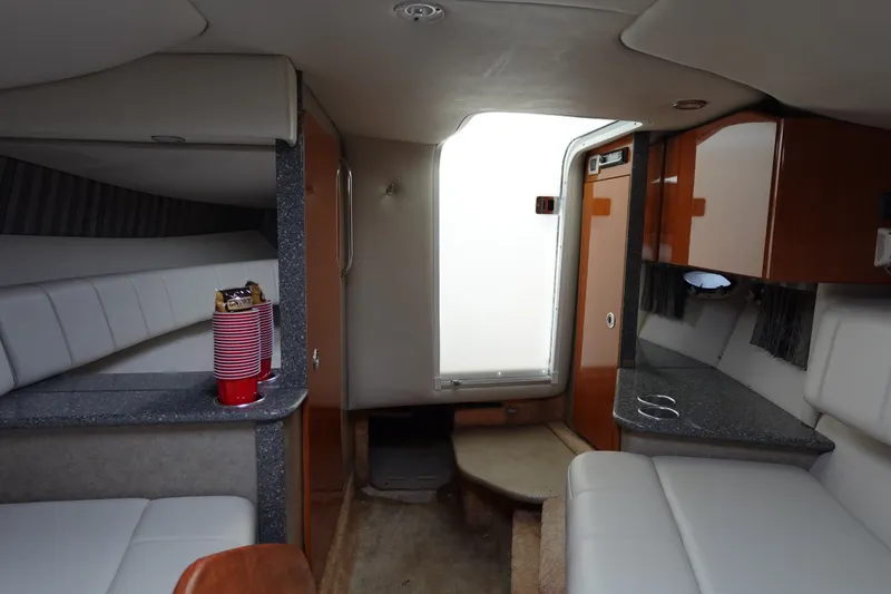 Slide: The Image of Interior of 2005 Formula 280 Sun Sport boat with seating and cabinets. - 55