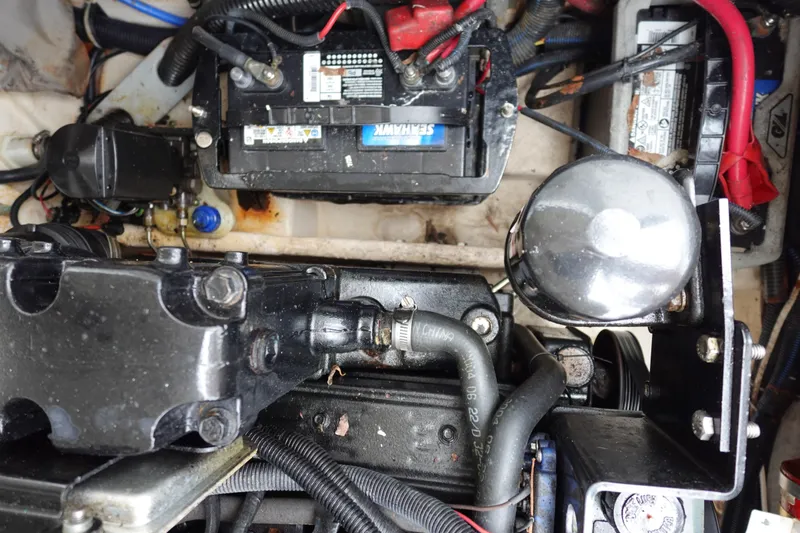Slide: The Image of Engine compartment of a 2005 Formula 280 Sun Sport boat, showing battery and components. - 68