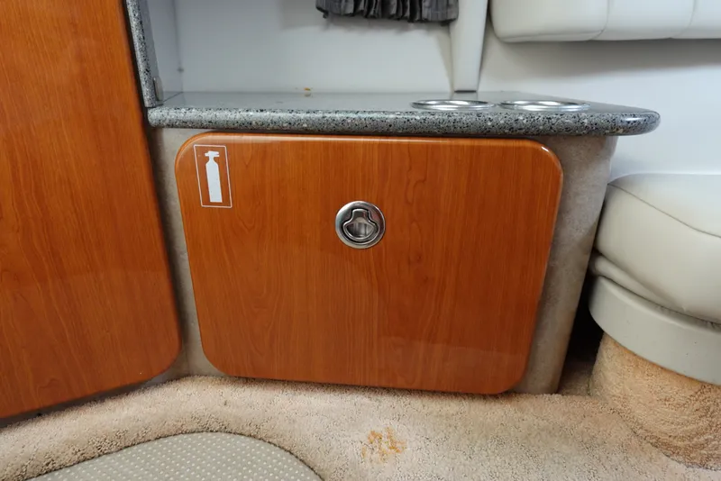 Slide: The Image of 2005 Formula 280 Sun Sport interior with wooden cabinet and granite countertop. - 52