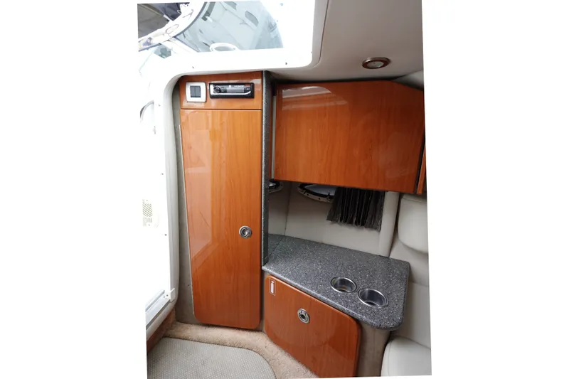 Slide: The Image of Interior of 2005 Formula 280 Sun Sport boat with wood cabinetry and countertop. - 48