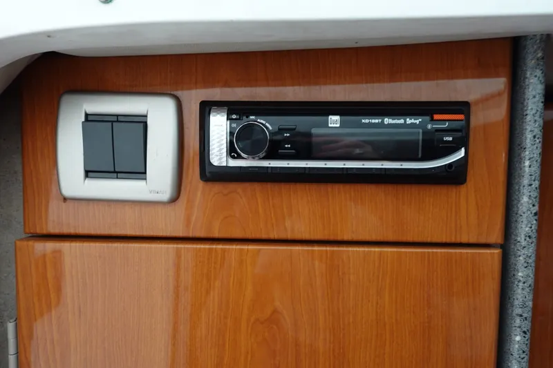 Slide: The Image of 2005 Formula 280 Sun Sport interior with wood paneling and audio system. - 50