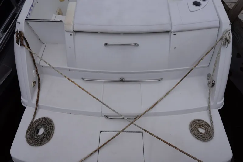 Slide: The Image of Rear view of a Formula 280 Sun Sport boat with ropes and seating area. - 41