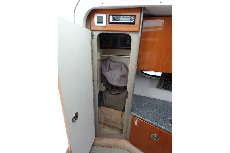 Slide: The Image of Interior cabin of 2005 Formula 280 Sun Sport boat with storage and control panel. - 49