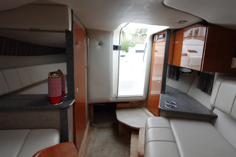 Slide: The Image of Interior of 2005 Formula 280 Sun Sport boat with seating and kitchenette. - 54