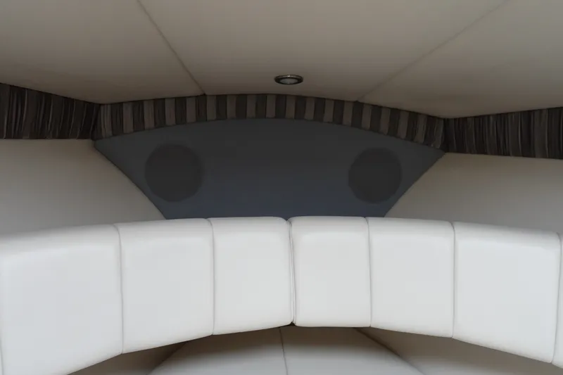 Slide: The Image of Interior of a 2005 Formula 280 Sun Sport boat with white cushioned seating. - 58