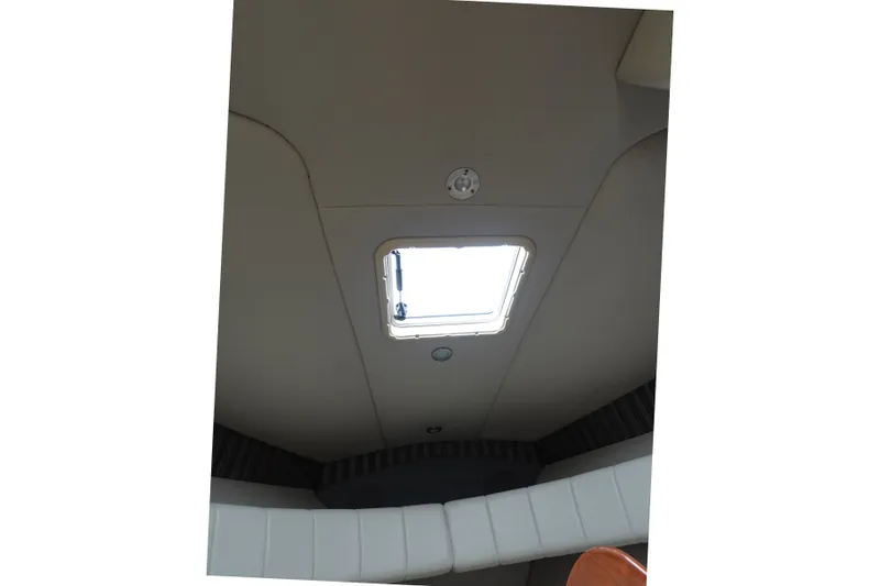 Slide: The Image of Interior cabin view of a 2005 Formula 280 Sun Sport boat with a ceiling hatch. - 57