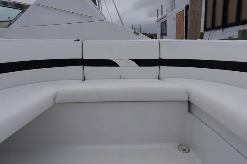 Slide: The Image of White seating area on a Formula 280 Sun Sport boat, featuring sleek black accents. - 30