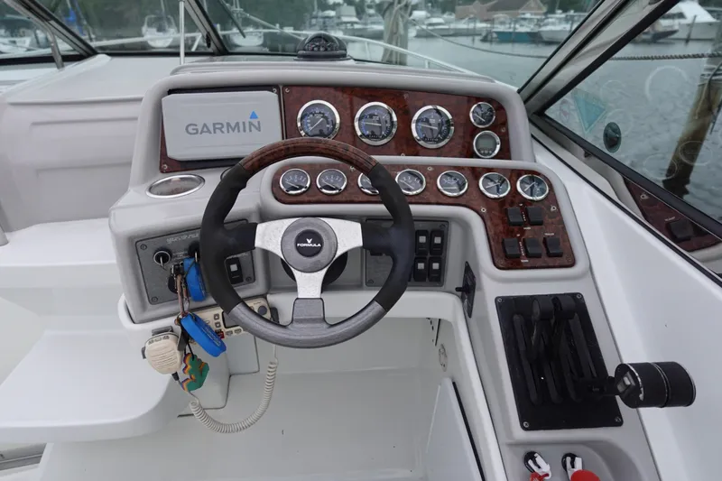 Slide: The Image of Cockpit of Formula 280 Sun Sport boat with Garmin navigation system and control panel. - 22