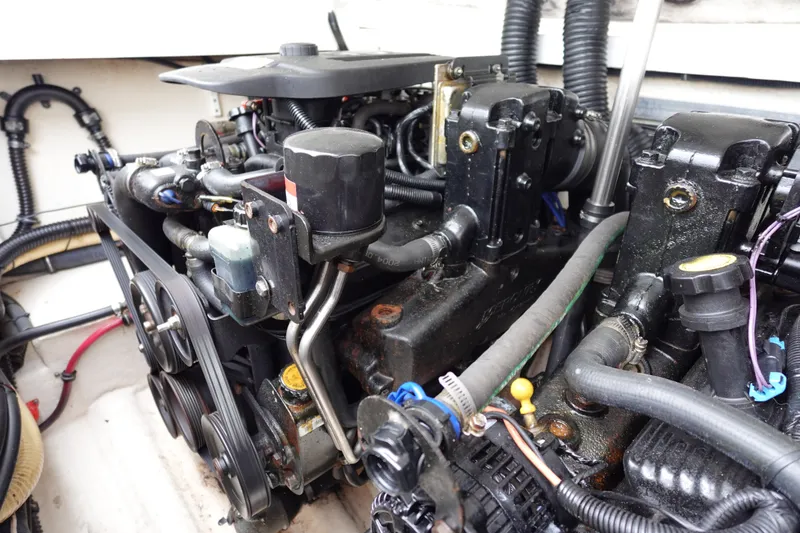 Slide: The Image of Engine compartment of a 2005 Formula 280 Sun Sport boat, showcasing mechanical components. - 67