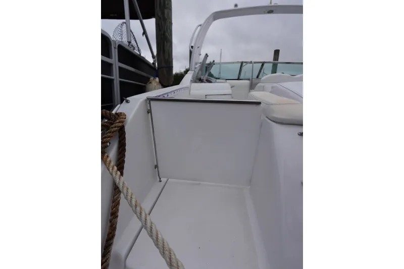 Slide: The Image of Interior view of a Formula 280 Sun Sport boat, featuring white seating and deck. - 40