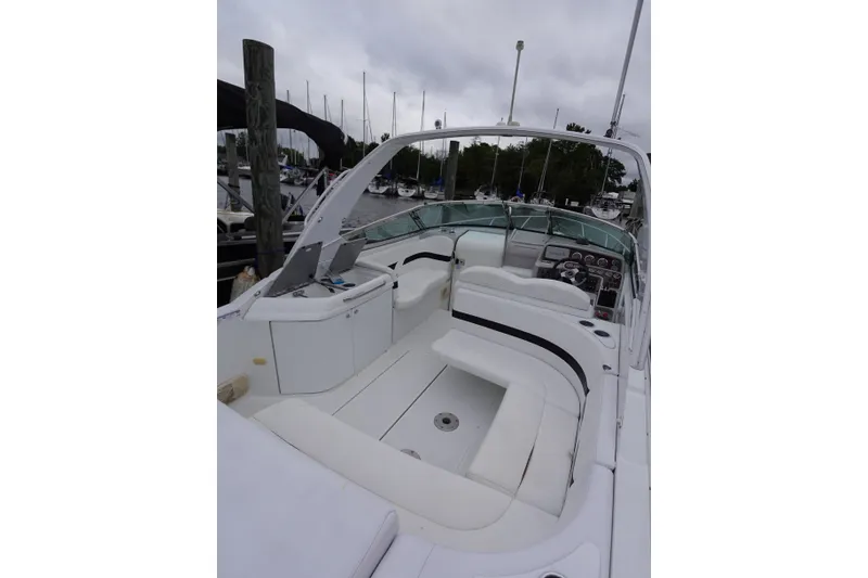 Slide: The Image of Luxury Formula 280 Sun Sport boat with spacious seating and sleek design at marina. - 27