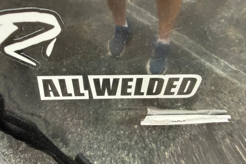 Slide: The Image of "All Welded" sticker on 2024 Tracker Pro Team 175 TF boat surface. - 28