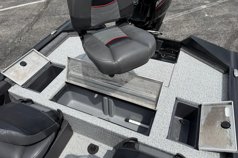 Slide: The Image of 2024 Tracker Pro Team 175 TF boat interior with seating and storage compartments. - 16