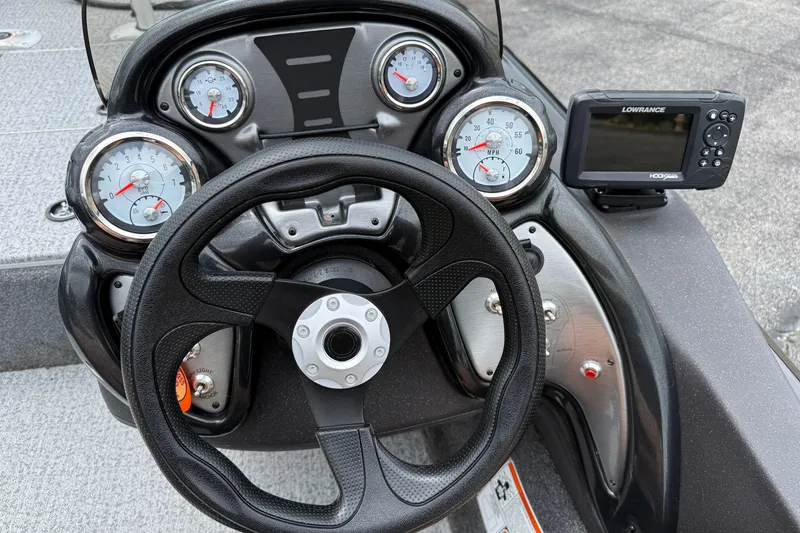 Slide: The Image of Steering console of 2024 Tracker Pro Team 175 TF boat with gauges and Lowrance fishfinder. - 12