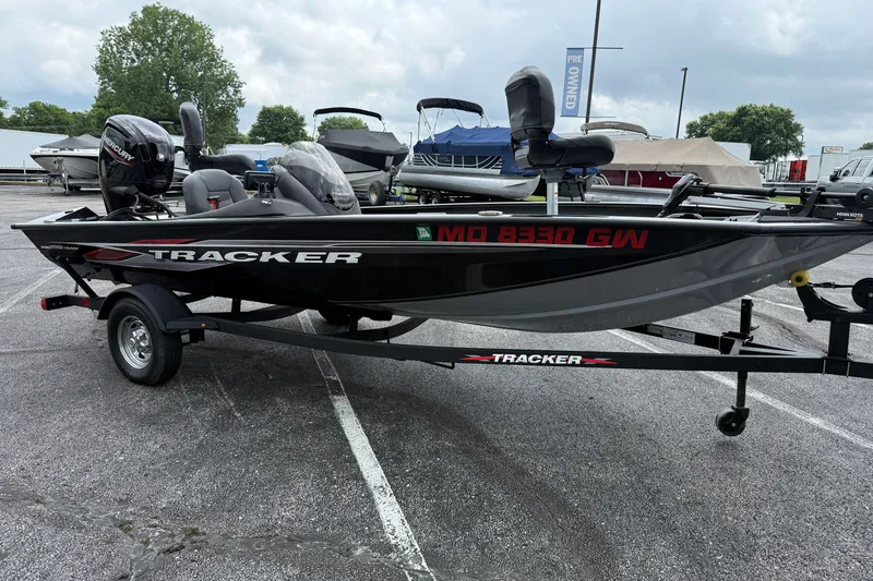 Slide: The Image of 2024 Tracker Pro Team 175 TF fishing boat on trailer in parking lot. - 3
