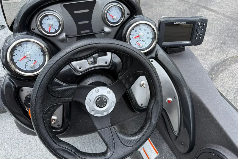 Slide: The Image of 2024 Tracker Pro Team 175 TF dashboard with steering wheel and gauges. - 8