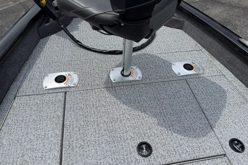 Slide: The Image of 2024 Tracker Pro Team 175 TF boat deck with adjustable seating and carpeted flooring. - 15
