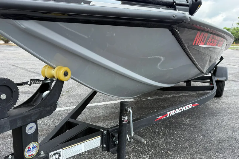 Slide: The Image of 2024 Tracker Pro Team 175 TF boat on trailer, close-up view of hull and branding. - 22