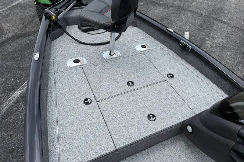 Slide: The Image of 2024 Tracker Pro Team 175 TF boat deck with seating and storage compartments. - 7
