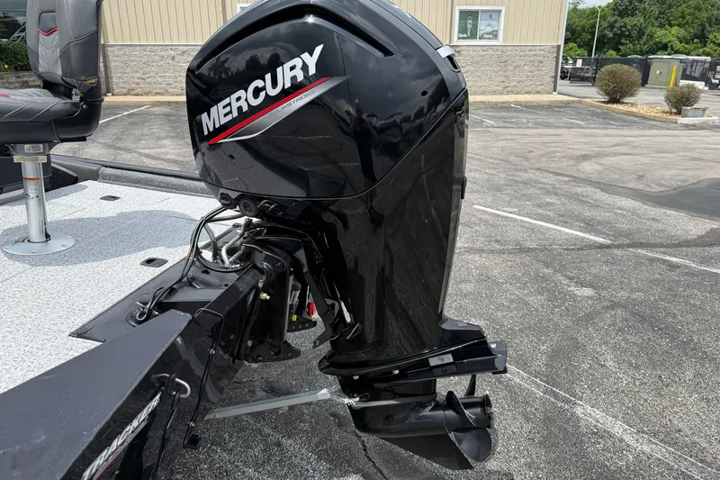 Slide: The Image of 2024 Tracker Pro Team 175 TF boat with Mercury outboard motor in parking lot. - 19