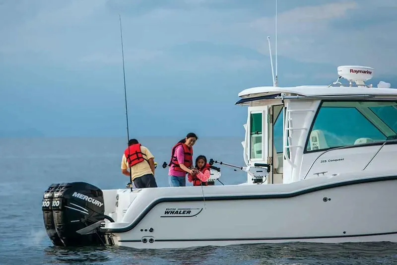 Slide: The Image of Manufacturer Provided Image: Family fishing on a 2019 Boston Whaler 315 Conquest Pilothouse boat. - 5