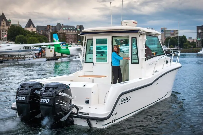 Slide: The Image of Manufacturer Provided Image: 2019 Boston Whaler 315 Conquest Pilothouse on water with twin Mercury 300 engines. - 4