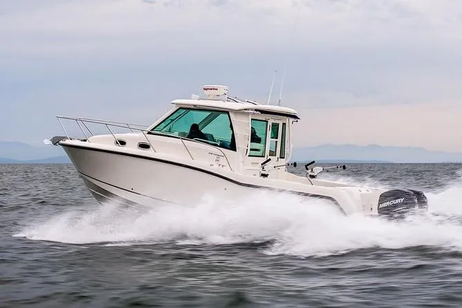 The Image of Manufacturer Provided Image: 2019 Boston Whaler 315 Conquest Pilothouse cruising on open water. - 0