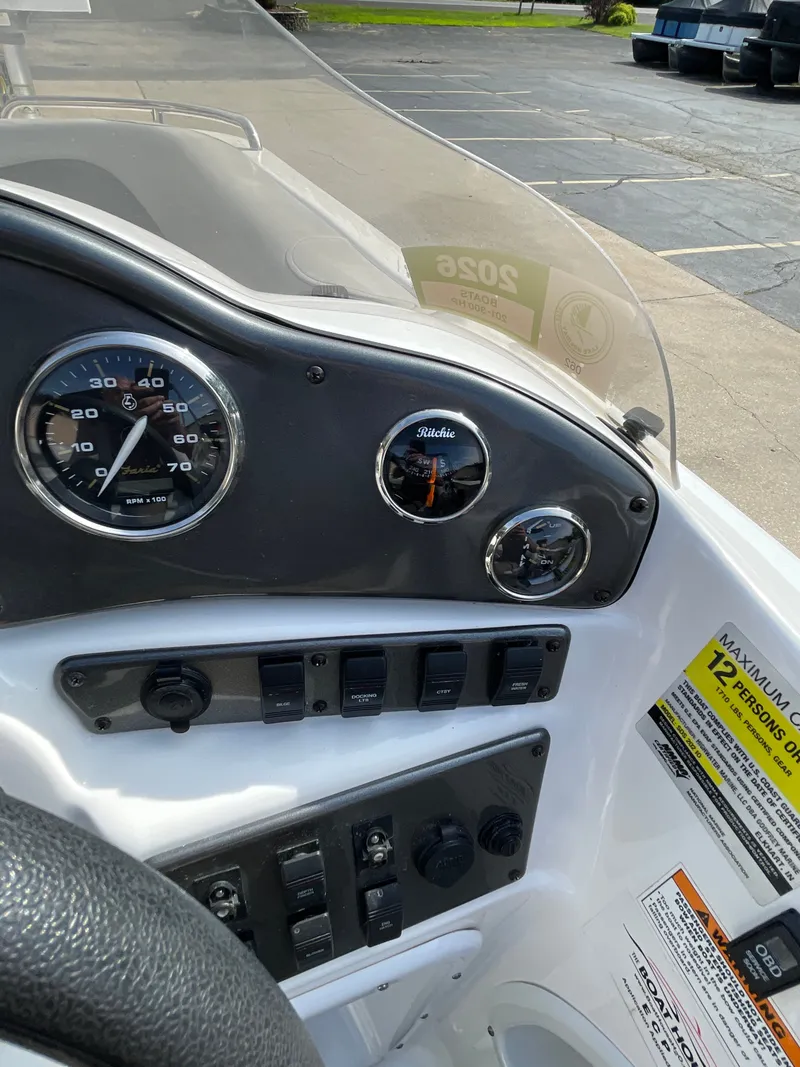 Slide: The Image of The image shows the dashboard of a 2018 Hurricane SS202 boat with a speedometer and compass. - 25