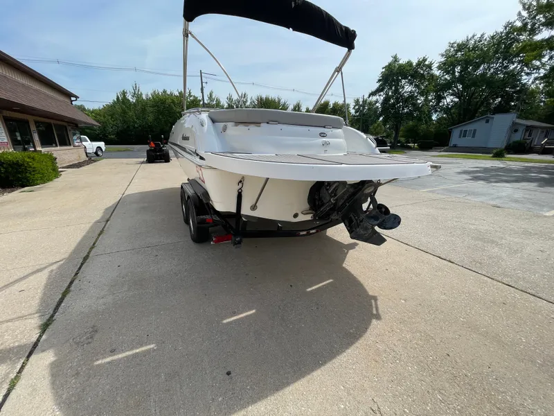 Slide: The Image of A 2018 Hurricane SS202 boat is on a trailer in a parking lot. - 5